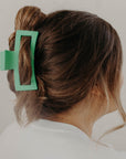 brunette hair in jade green hair clip