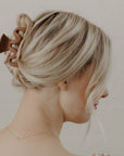 brown squiggle hair clip in blonde hair