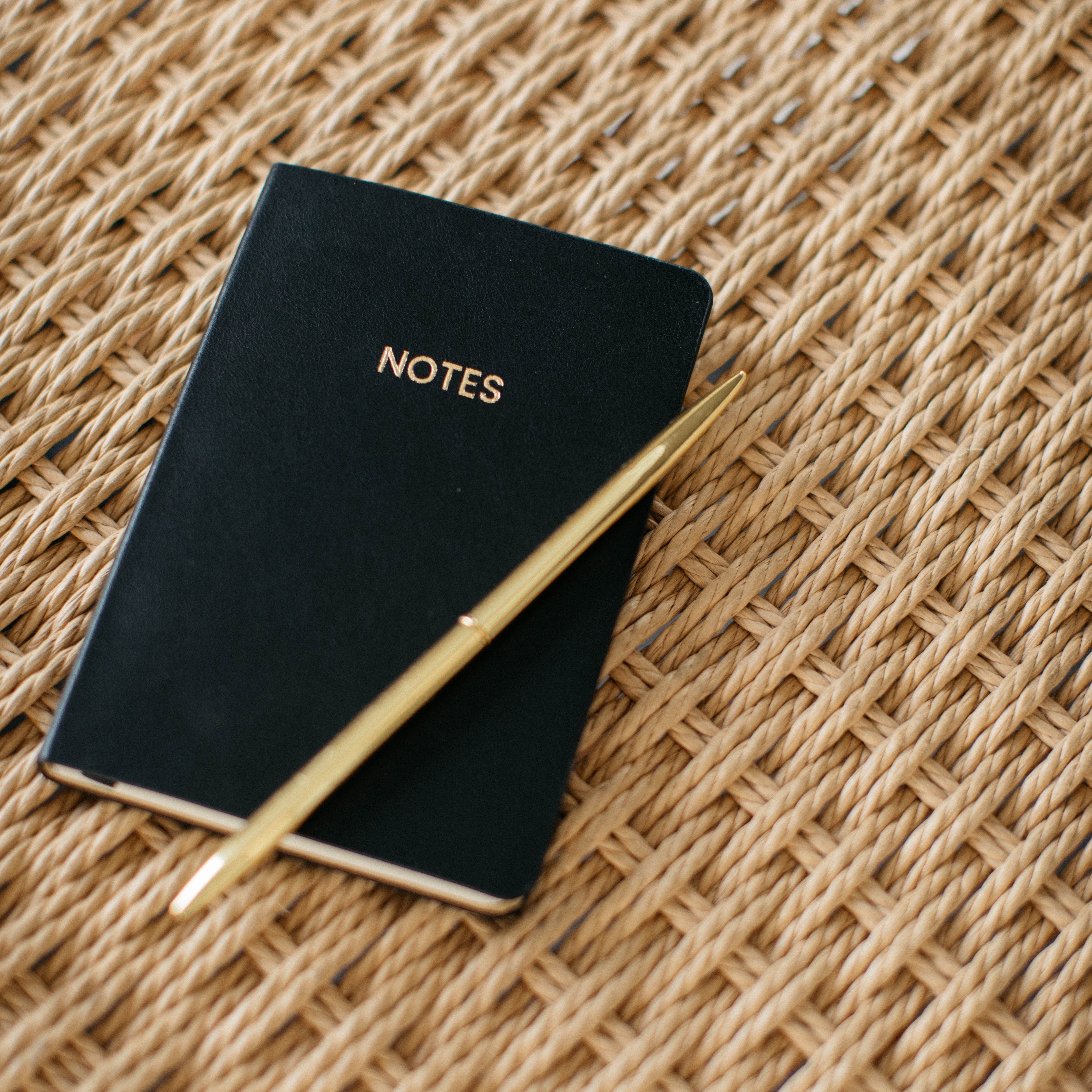 Black A6 Pocket Notebook with gold "NOTES" on the cover