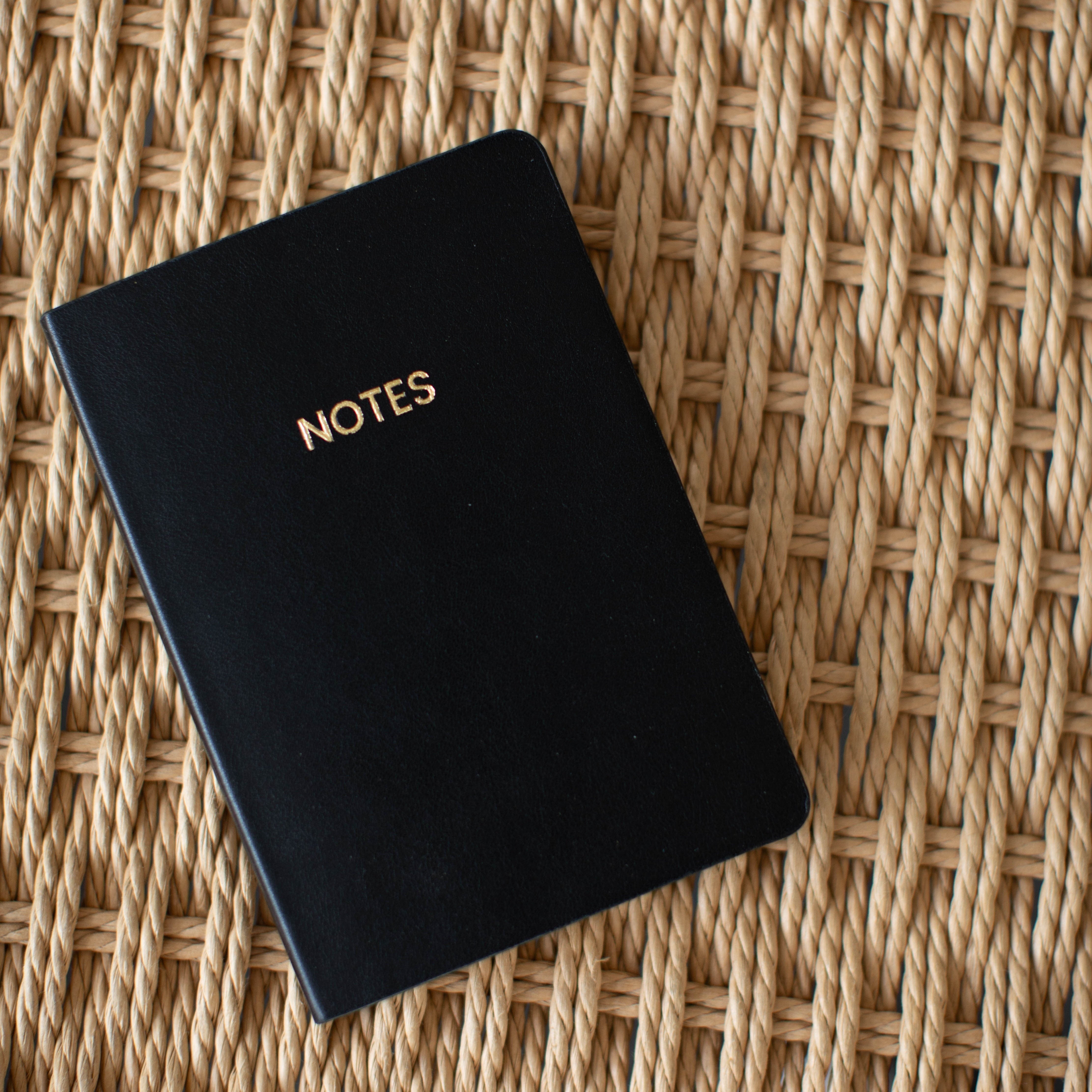 Black A6 Pocket Notebook with gold "NOTES" on the cover