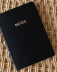 Black A6 Pocket Notebook with gold "NOTES" on the cover