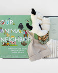 BOXFOX black New Family Gift Box packed with PEHR cozy grey striped onesie 3-6 months, Jellycat puppy lovey, Our Animal Neighbors book, Pipette baby oil, Alva sage green teether, and Alva grey beanie.