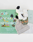 BOXFOX Original creme New Family Gift Box packed with PEHR cozy grey striped onesie 3-6 months, Jellycat puppy lovey, Our Animal Neighbors book, Pipette baby oil, Alva sage green teether, and Alva grey beanie
