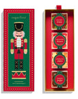 box with image of a nutcracker on it. inside are 4 candy cubes: holiday trees, mistletoe kisses, sparkling stars, and sparkle pops