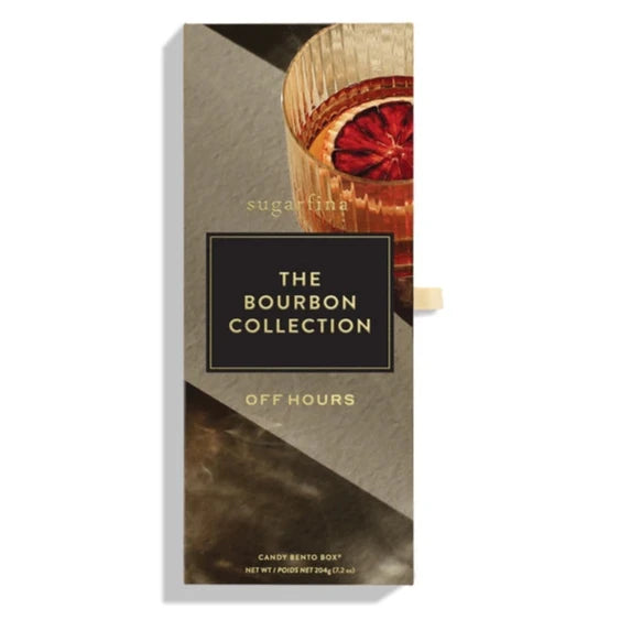 A sleek and elegant rectangular box labeled "The Bourbon Collection" by Sugarfina. The design features a rich, moody background and a glass of bourbon garnished with a dried orange slice.