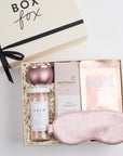 BOXFOX Pink Pamper Gift Box with mini tin candle, bath salts, milk chocolate bar, sheet mask, and silk sleep mask