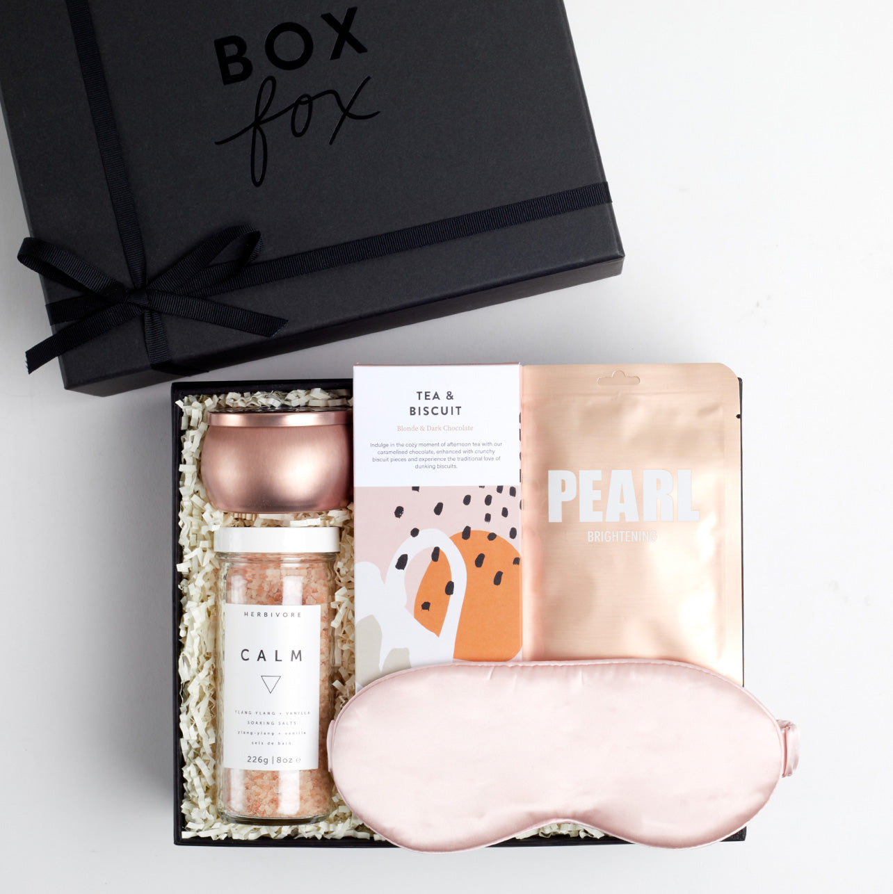BOXFOX Black Gift Box filled with Azeria Pink Silk Sleep Mask, Herbivore Botanicals Calm Bath Salts, Voluspa Prosecco Rose Candle, Lapcos Pearl Sheet Mask and The chocolate society chocolate bar