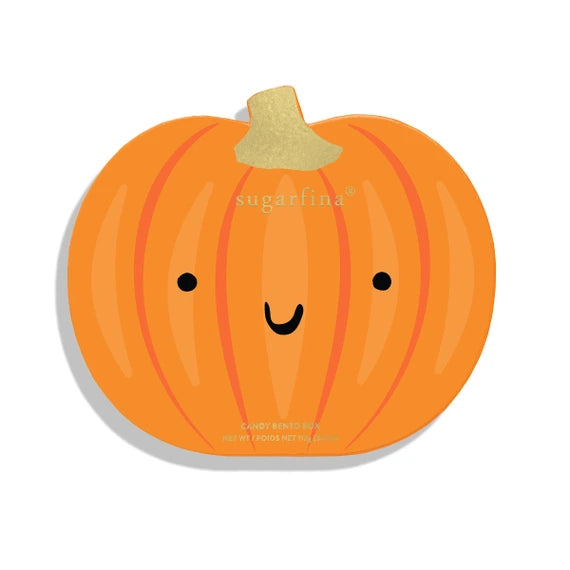 An orange pumpkin-shaped candy tin with a cute smiling face, black dot eyes, and a textured gold stem, shown on a white background with a soft drop shadow.