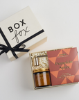 pumpkin spice chocolate barm pumpkin spice candle, and gold candle snuffer packed in creme BOXFOX