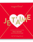 red letter shaped chocolate bar packaging with pink heart seal that says Je T'aime across it in gold