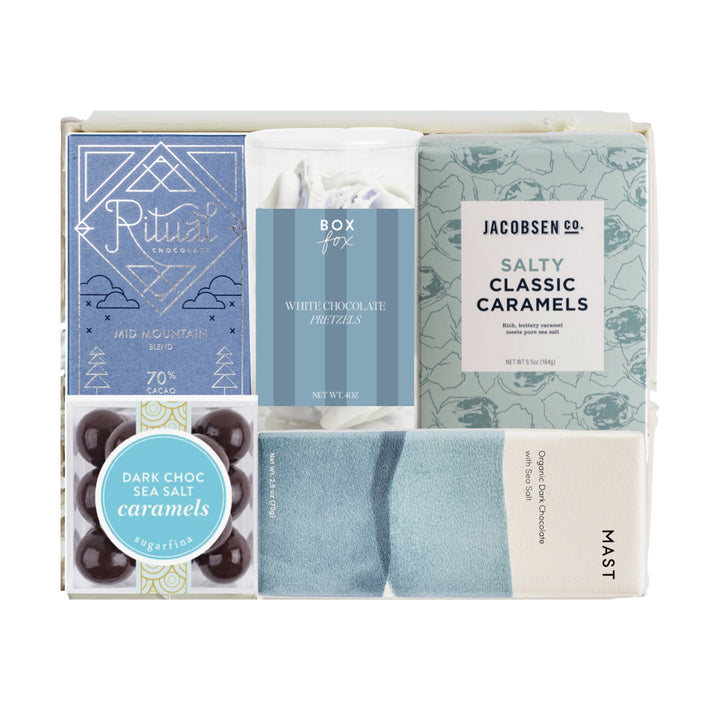 Assorted gift items including socks, candies, and a box of chocolates in a white box.