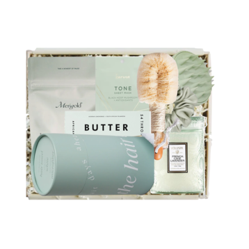 Skincare product set with 'Butter' branding in a box on a white background
