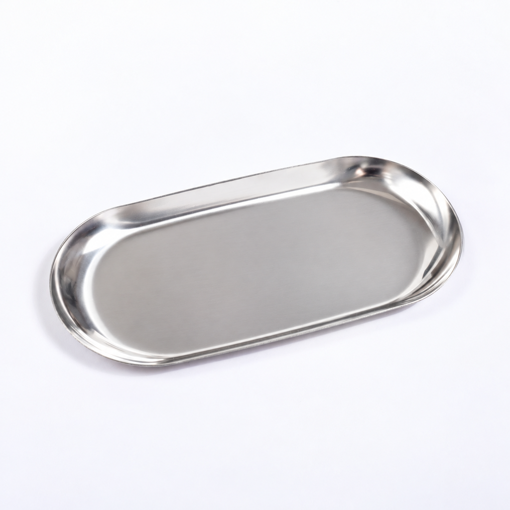A stainless steel oval serving tray with a brushed metallic finish, photographed on a clean white background.
