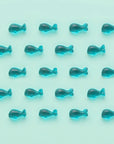 blue whale gummies lined up against a blue background