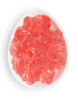 pink gummy bears in oval dish