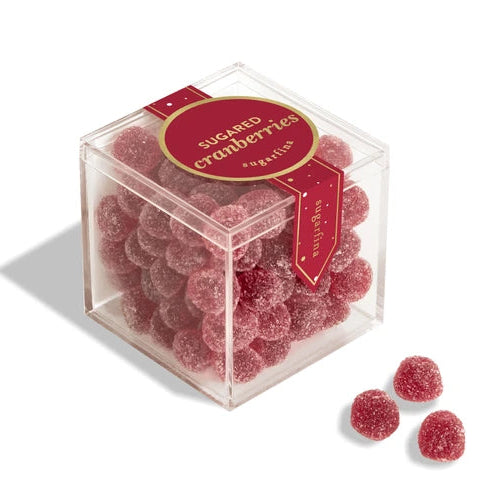 Clear cube box filled with sugared cranberries on a white background