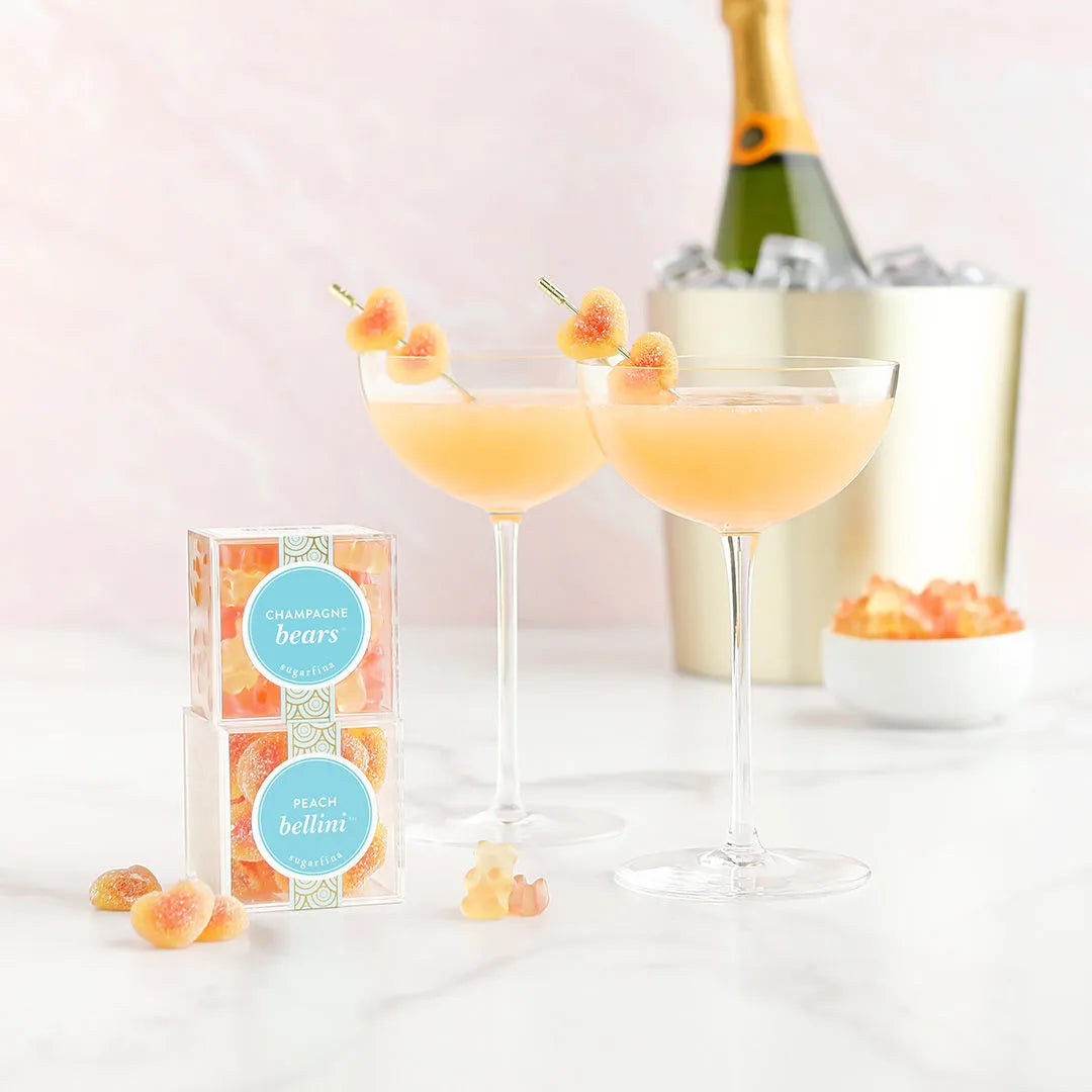 Peach Bellini Candy in champagne cocktail and next to packaging