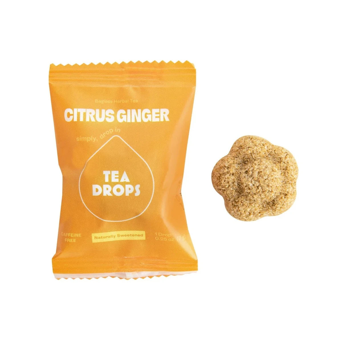 bright yellow tea drop packaging with white text. compressed tea flower next to it