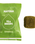 green tea cube next to green bag