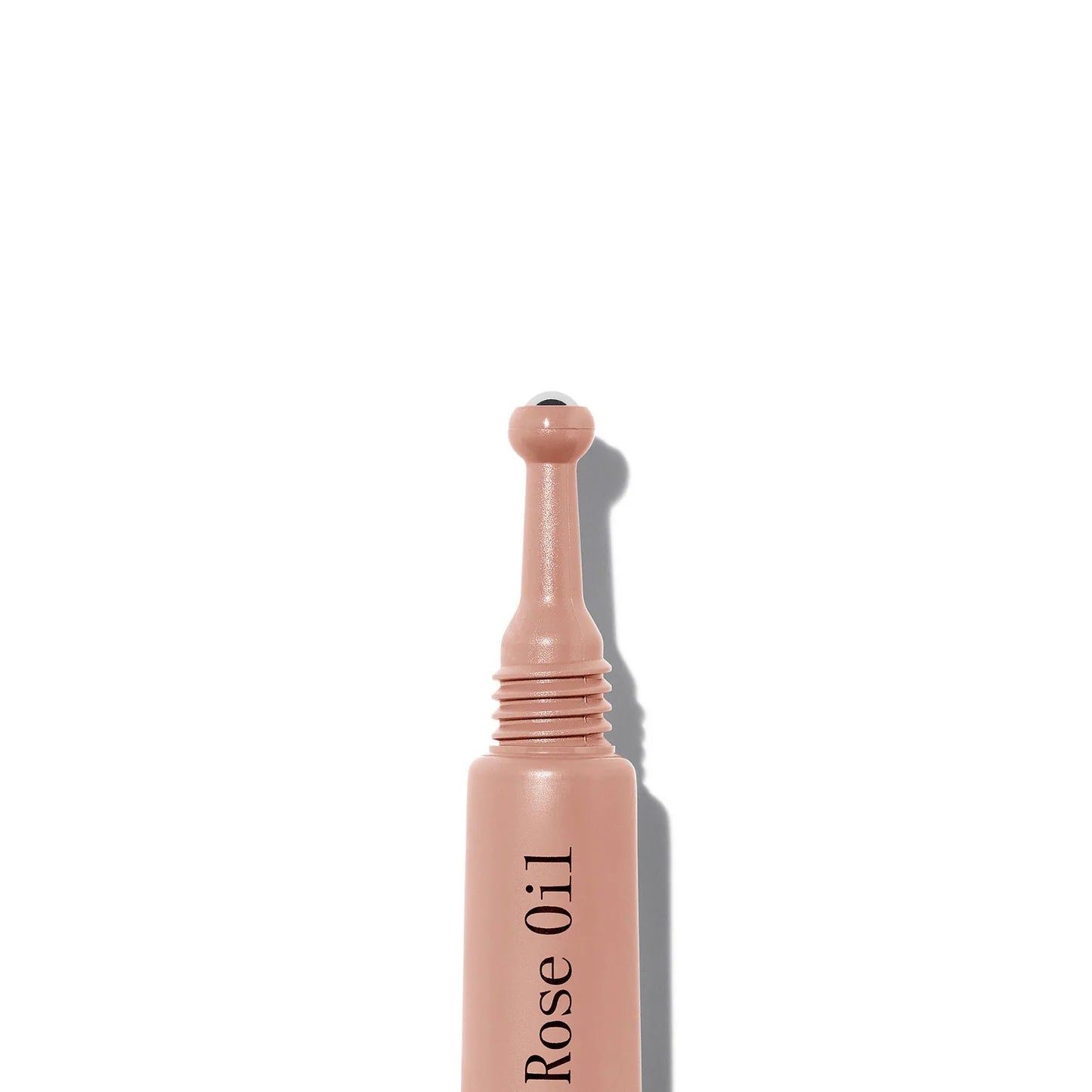 Rose oil dropper bottle on a white background