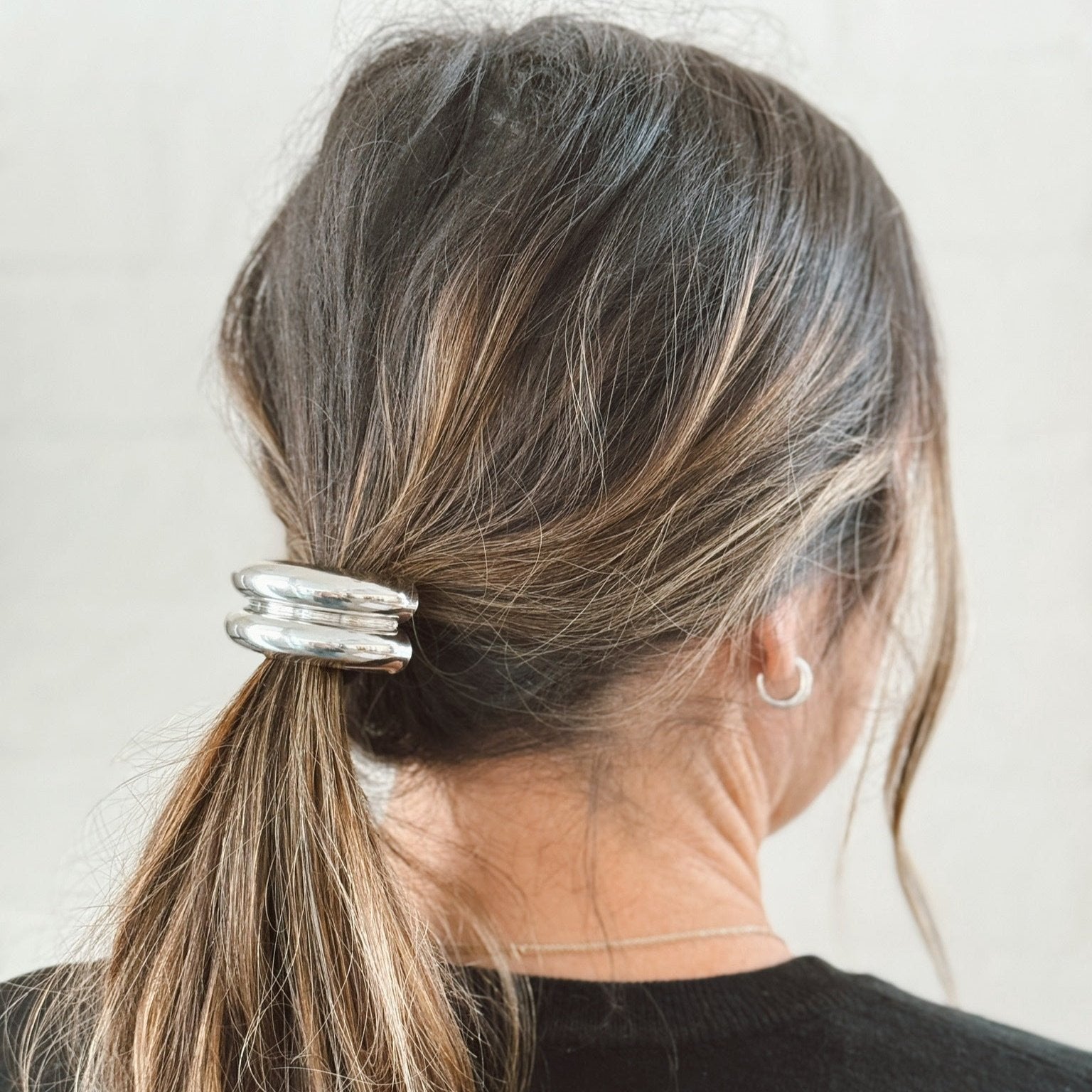 silver hair tie cuff in brown hair