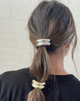 silver & gold hair tie cuffs in brown hair