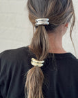 silver & gold hair tie cuffs in brown hair