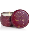 Capri Blue candle with 'Tinsel & Spice' scent on a white background