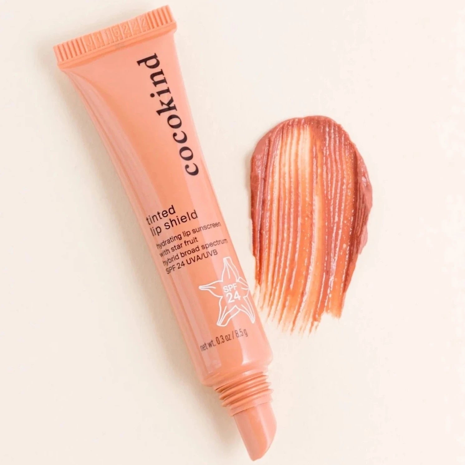 cocokind Tinted Lip Shield coral tube