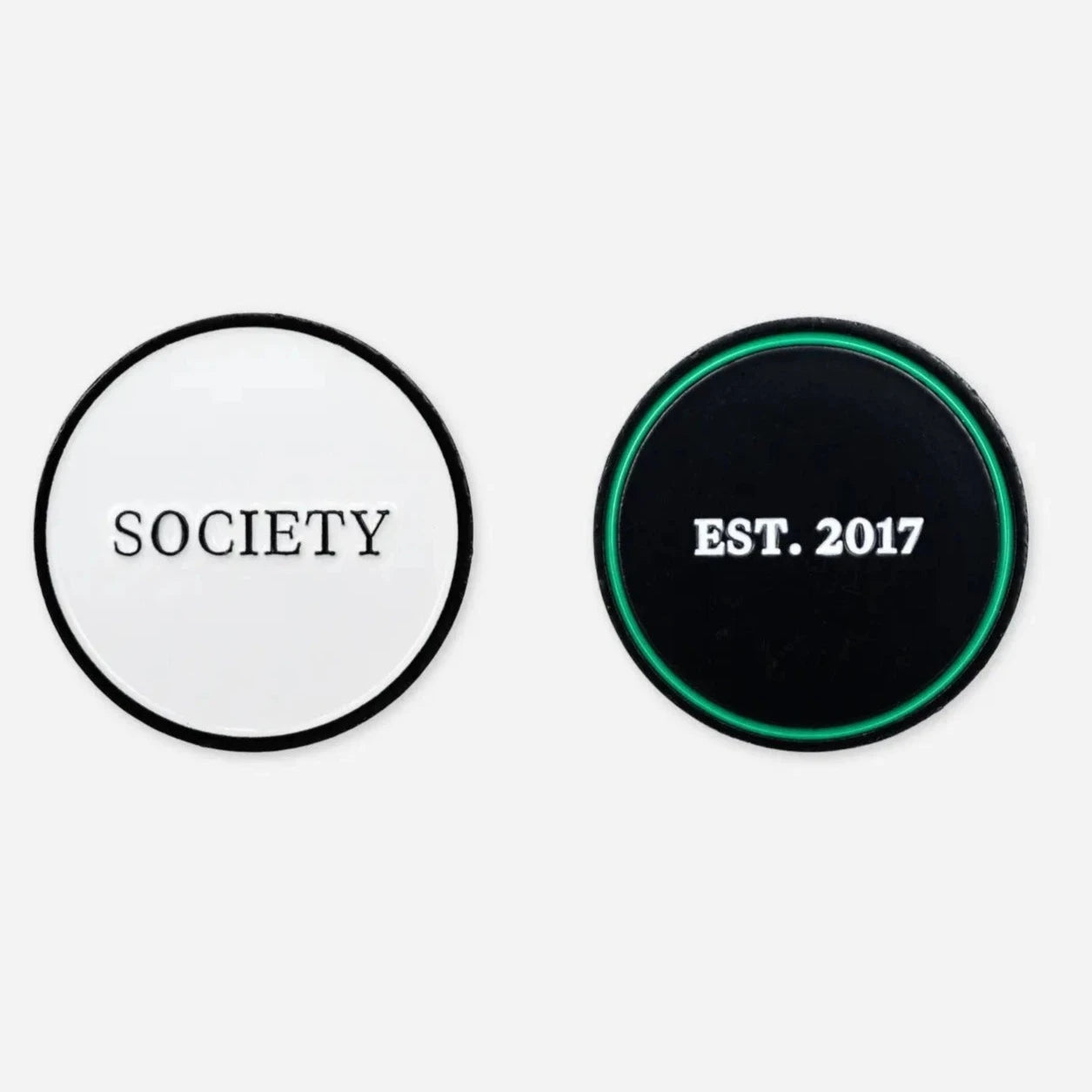 2 ball markers: 1 white with &#39;society&#39; written on it in black, 1 black and green with &#39;est. 2017&#39; written on it in white