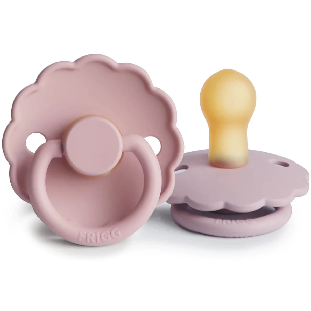 Two views of a lilac-colored FRIGG pacifier with a scalloped edge and a natural rubber nipple, designed for infants