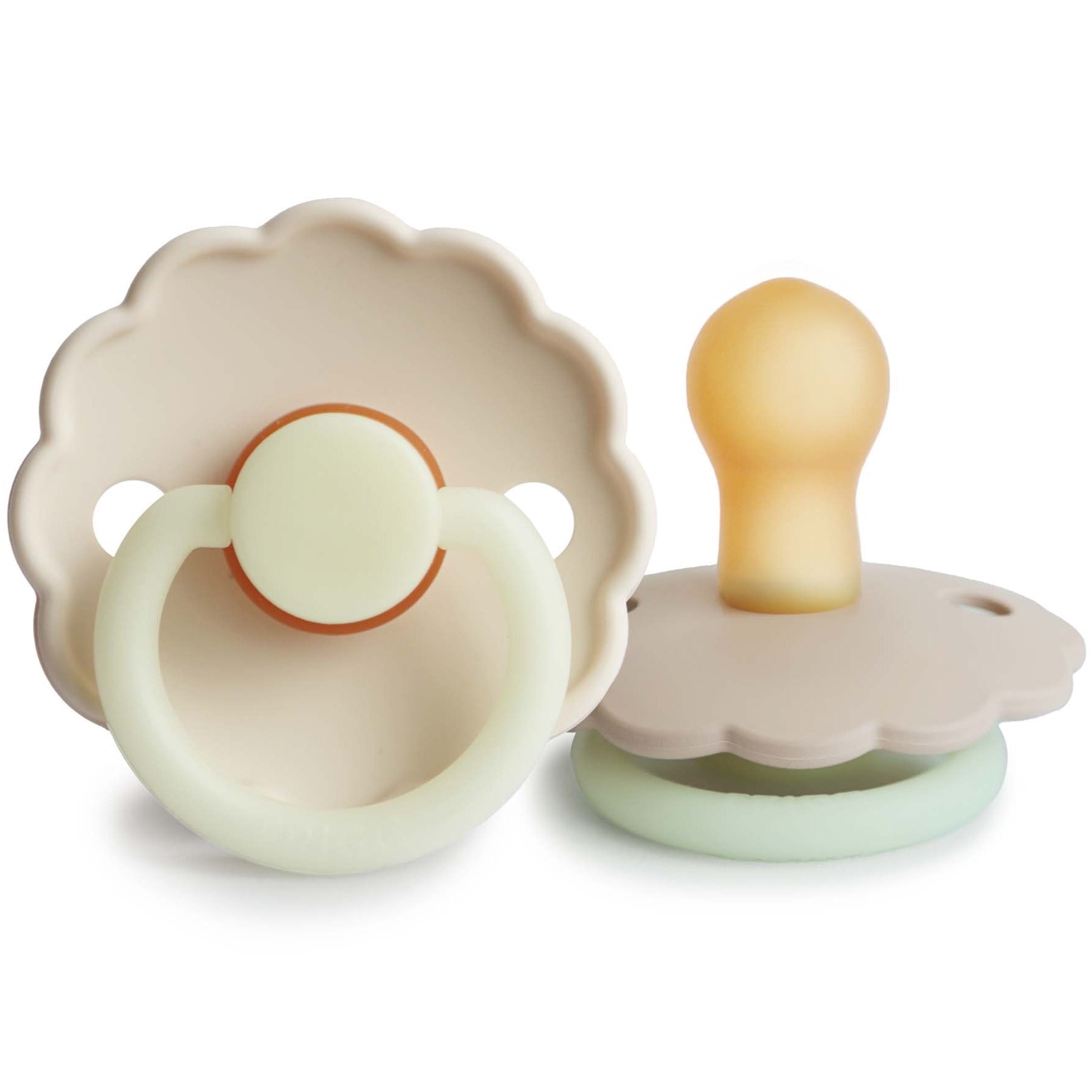 Neutral colored pacifiers. Base of the pacifier is shaped like a daisy with a light green handle.