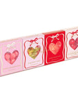 4 pink and red candy boxes