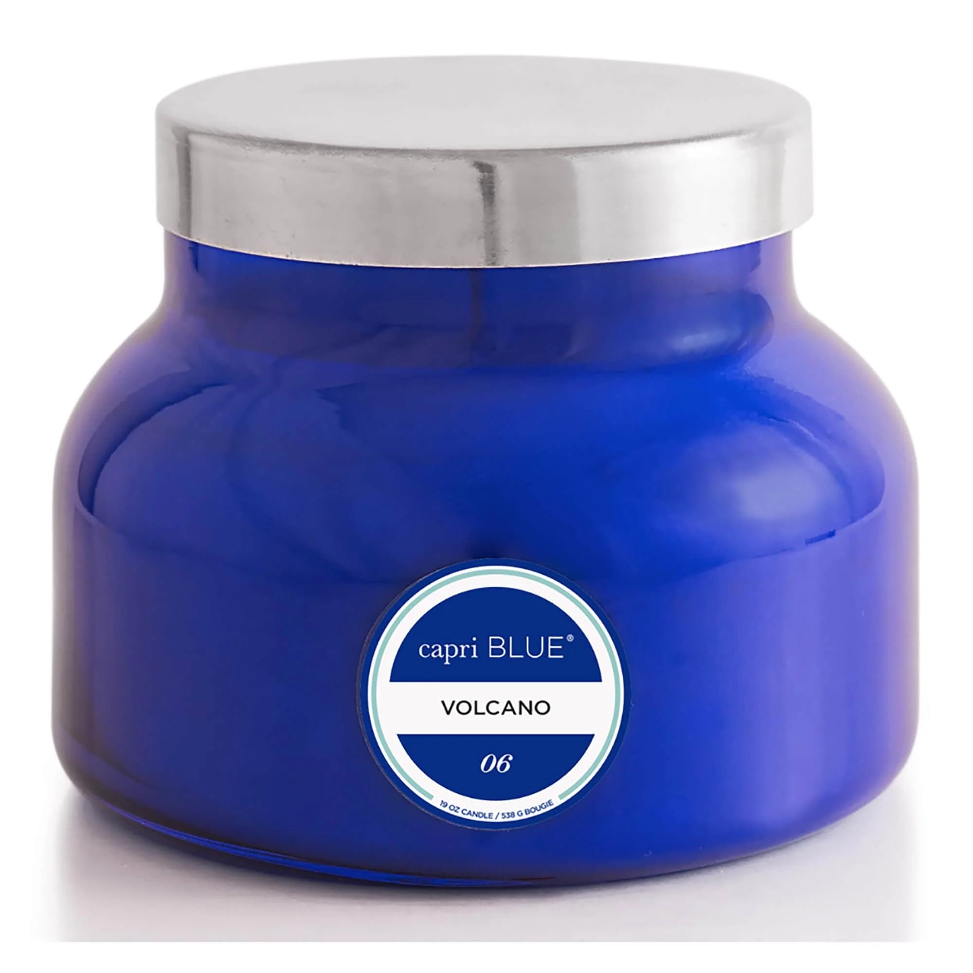 Blue candle jar with silver lid and 'capri BLUE' label on a white background