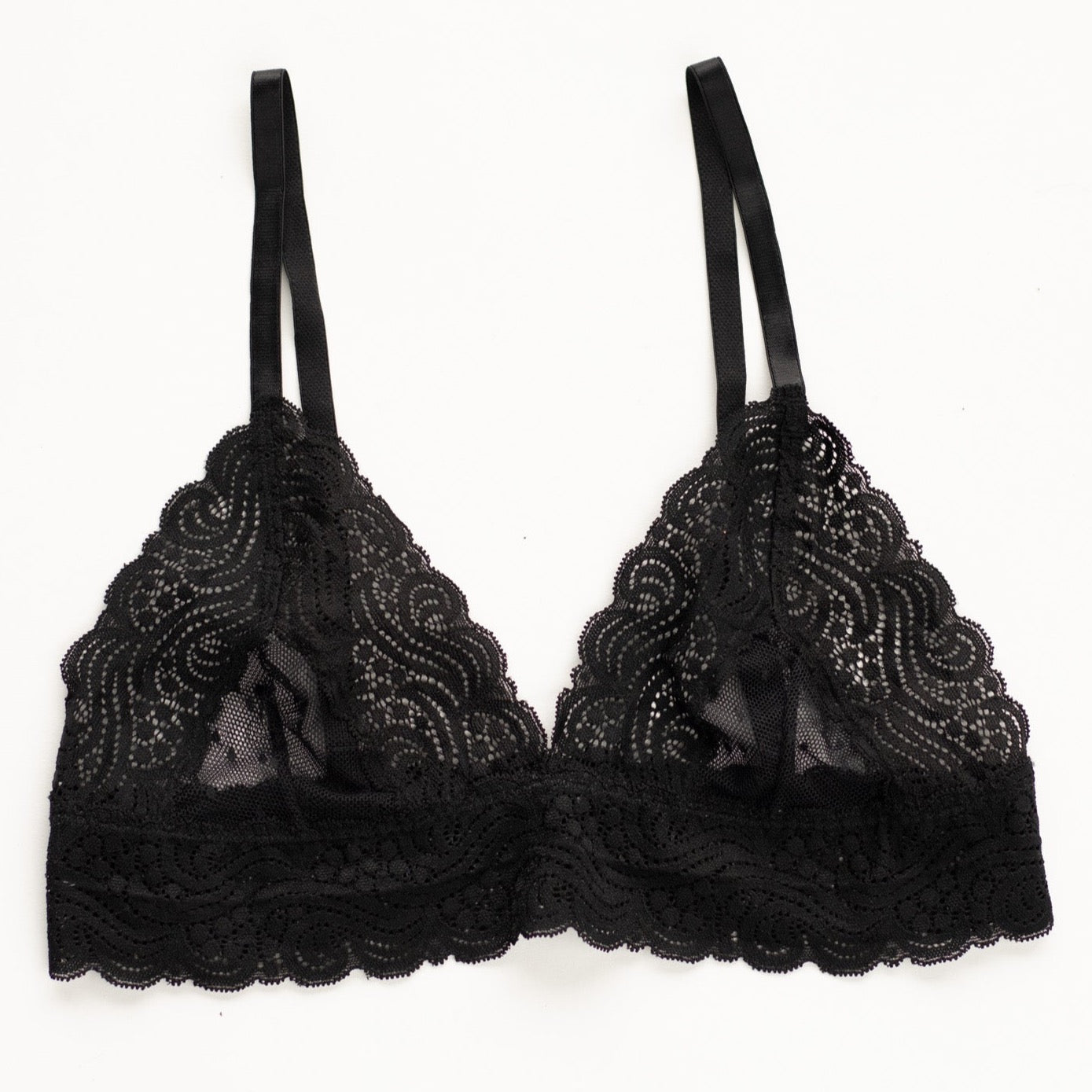 A black lace bralette on a white background.