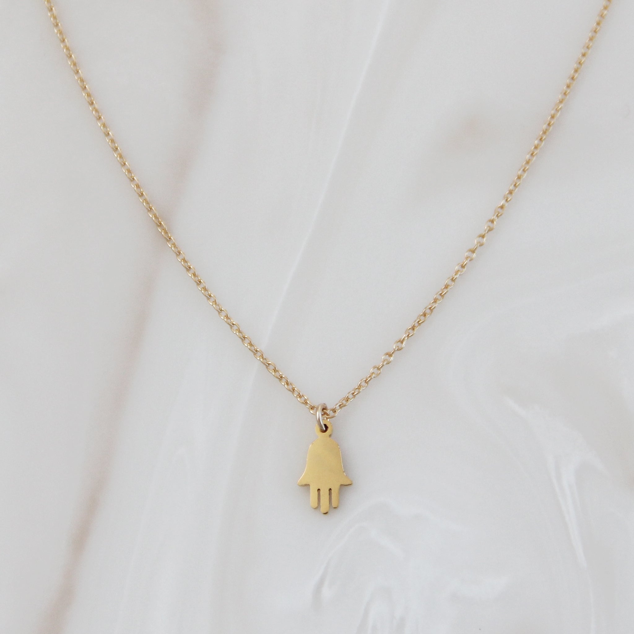 Gold Chain Hamsa Necklace on white background