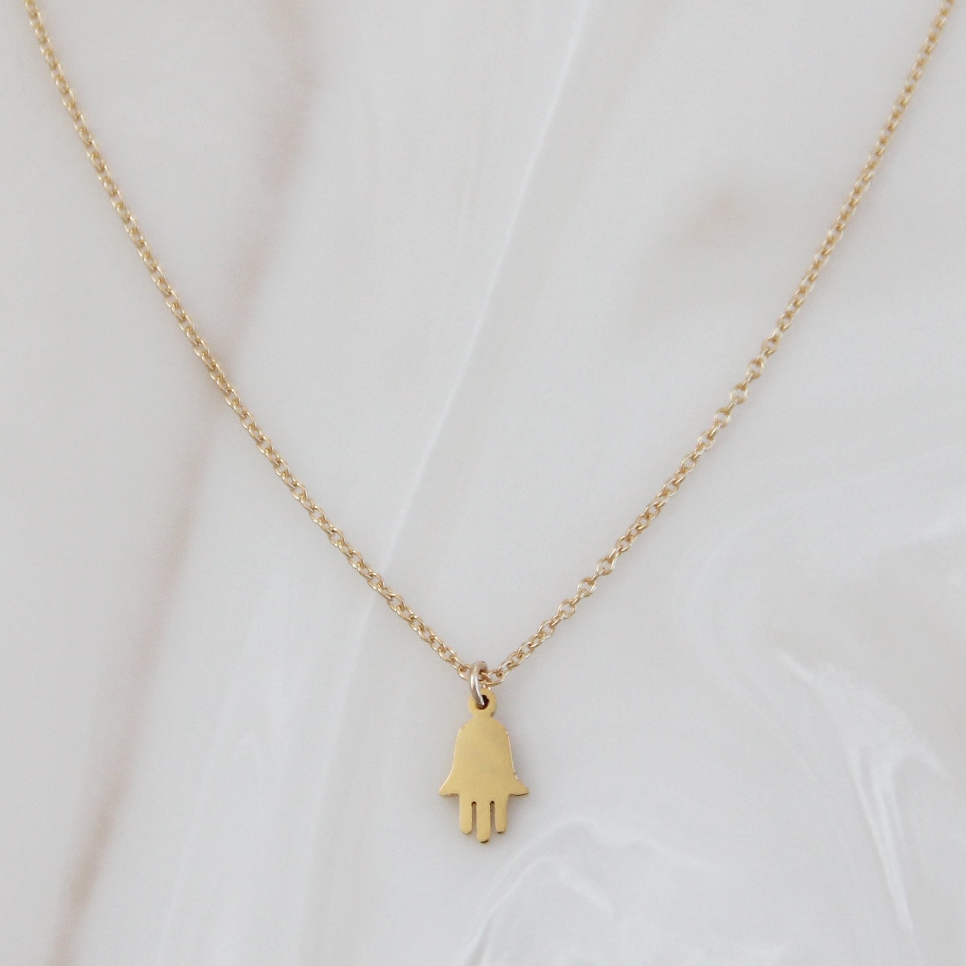 Gold Chain Hamsa Necklace on white background