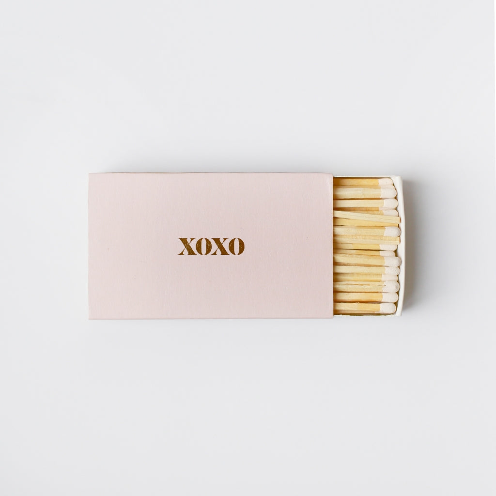 Pink Match Box with drawer of matches pulled out. Gold foil &quot;XOXO&quot; on top of box.