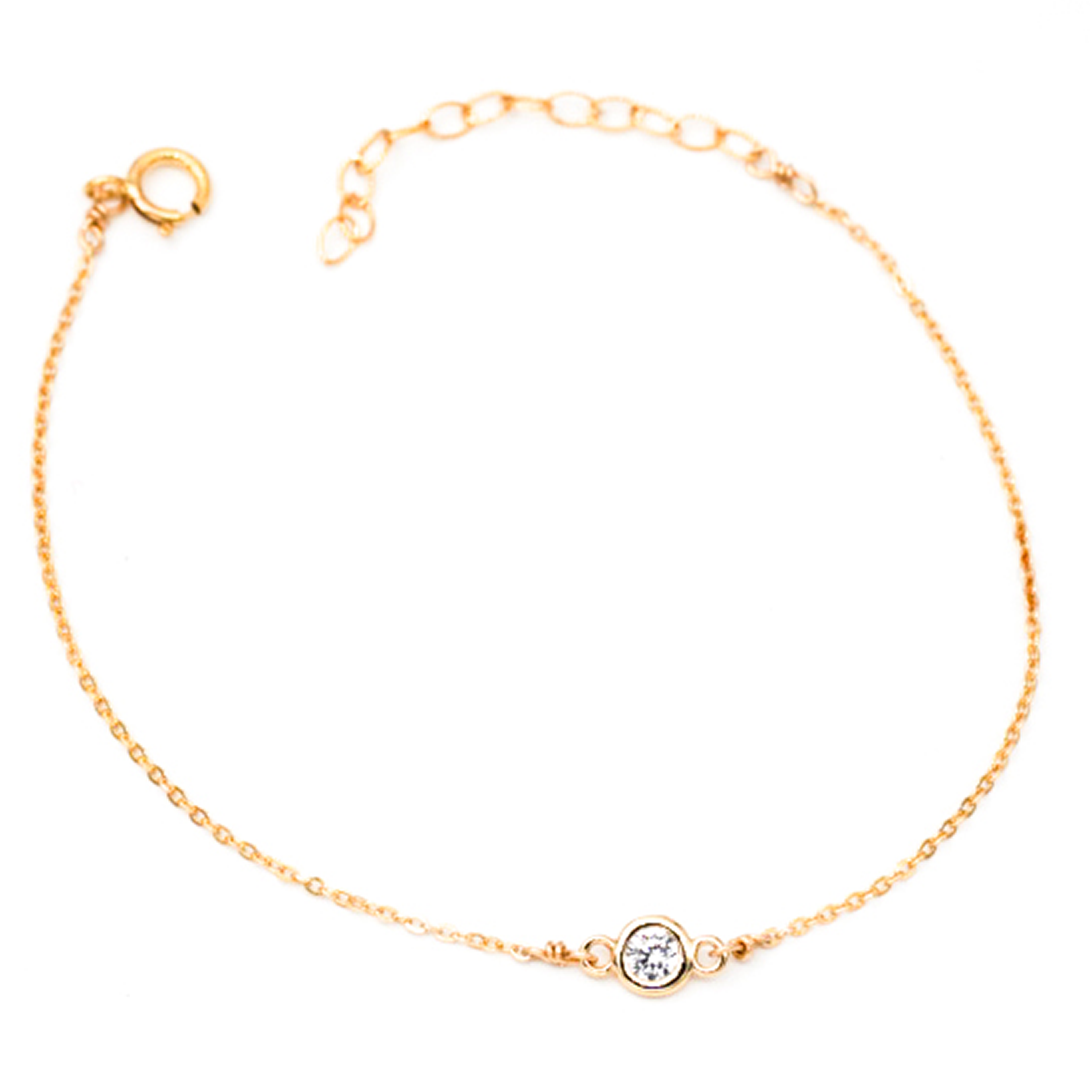 Dainty gold chain with small circular diamond in center.