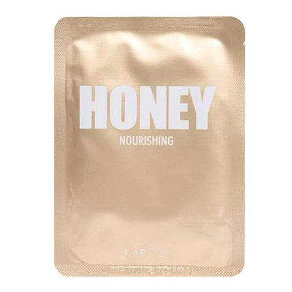 Gold face mask packaging that reads "HONEY NOURISHING LAPCOS"