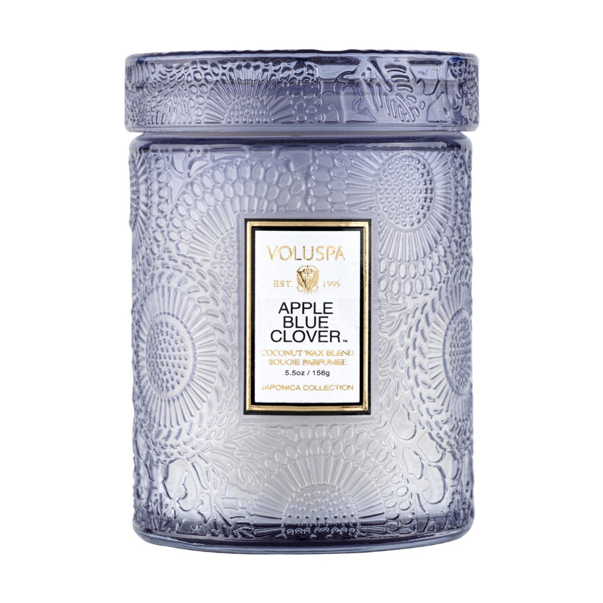 Apple Blue clover candle in purple glass embossed from top to bottom in the iconic Japonica wood block pattern.