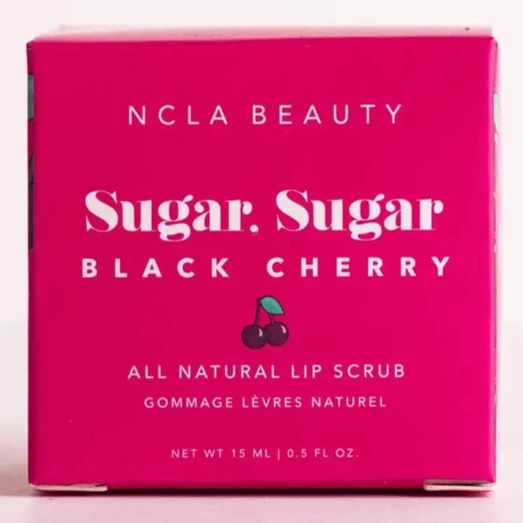 Magenta square box with white text on the front. Text reads "NCLA Beauty Sugar, Sugar Black Cherry All Natural Lip Scrub". Has a small cherry illustration under the name