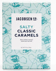 Light blue box with darker blue caramel candy outlines and a white box label in the front.