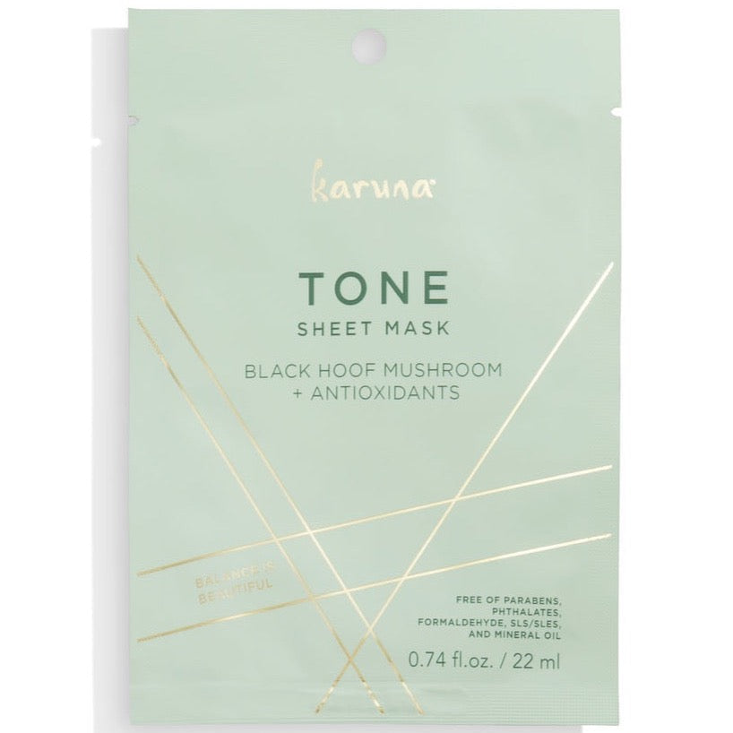 mint green packaging against white background. Gold accents at the bottom with koruna written at the top in gold. Front of mask reads the following in green "Tone Sheet Mask, Black Hoof Mushroom & Antioxidants"