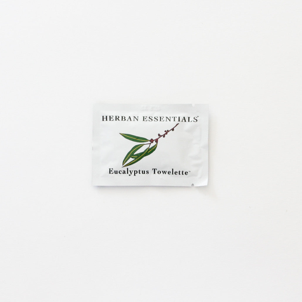 Single towelette packaging with eucalyptus branch on front.