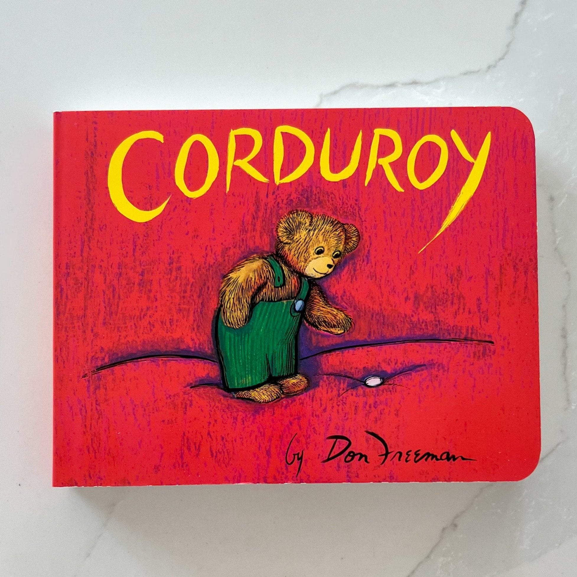 Red Corduroy Board Book on Marble counter