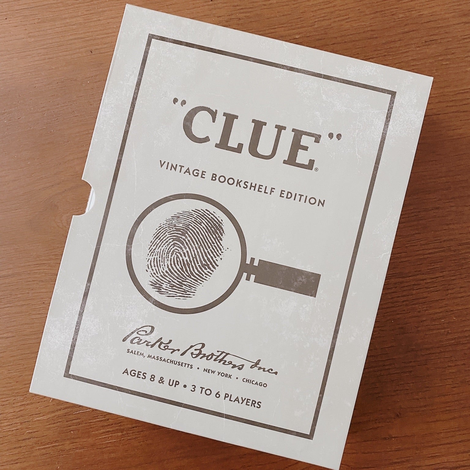 Clue Board Game on wood table.