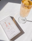 Pink Champagne Mug cake box next to glass of pink champagne