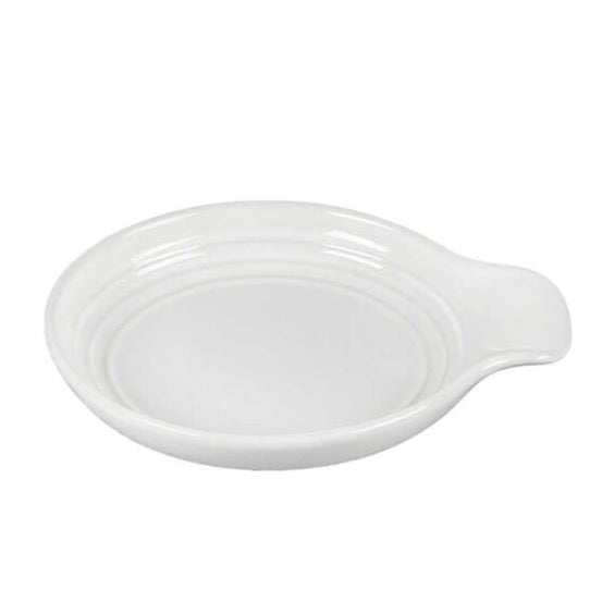 White round spoon rest on white background.