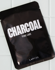 charcoal face mask, black rectangular shiny flat package